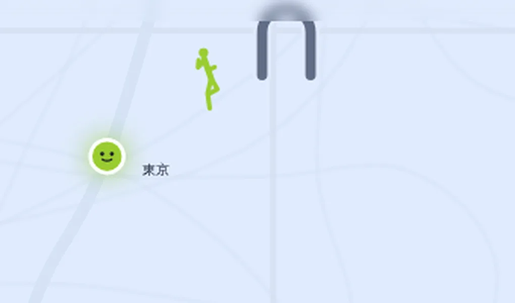 地图特写：车站进站口的拱形标记、一个正在迈步的小人，以及它要跑向的绿色东京站标记